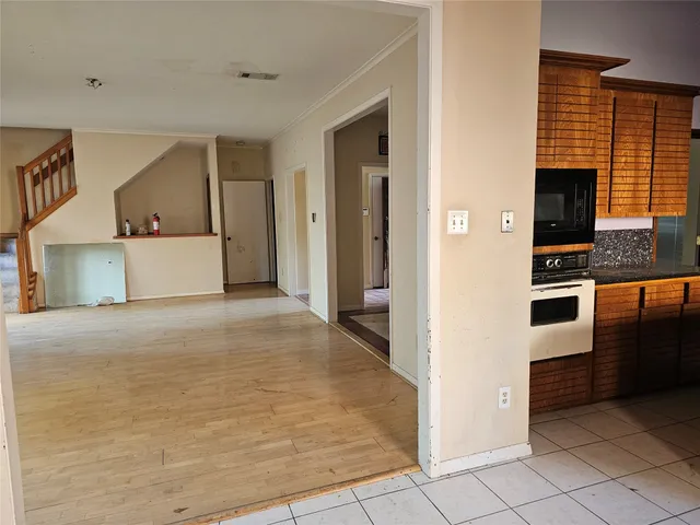 a view of kitchen with cabinets