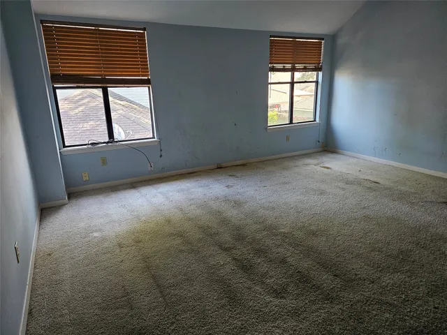 an empty room with windows