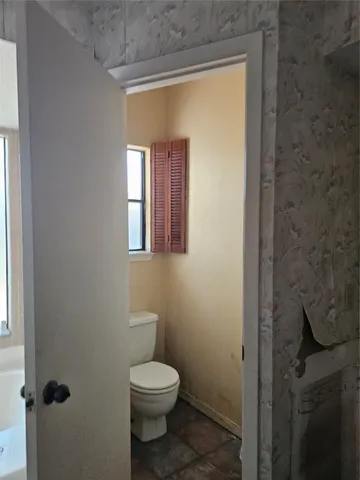 a bathroom with a toilet