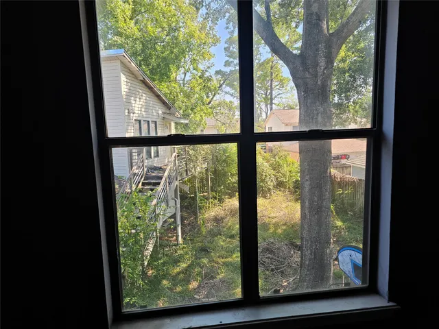 a view of an empty room and window