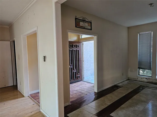 a view of hallway with wooden floor