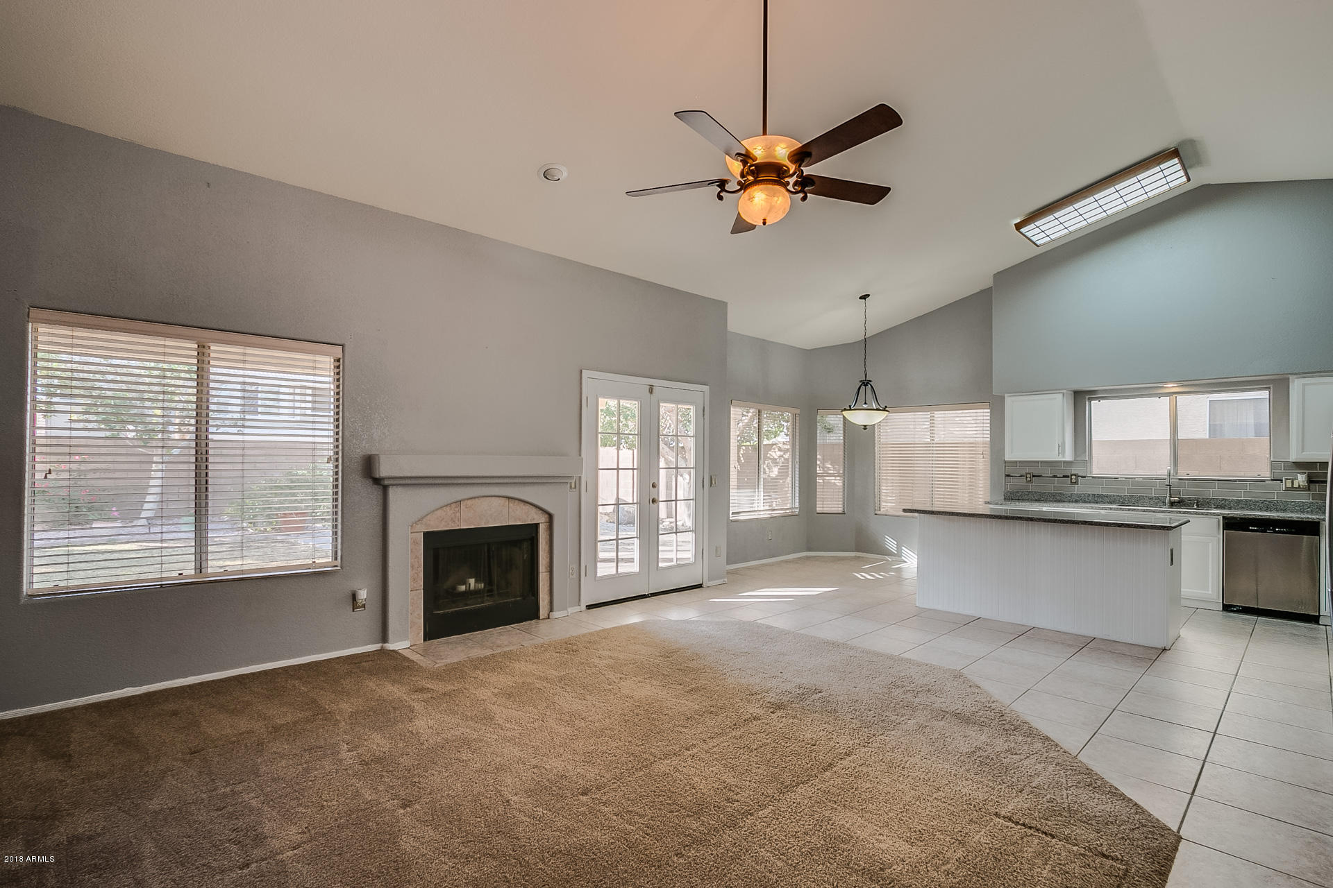 4225 East Rockledge Road Phoenix, AZ 85044 - Photo 8 of 20 Open family room with fireplace
