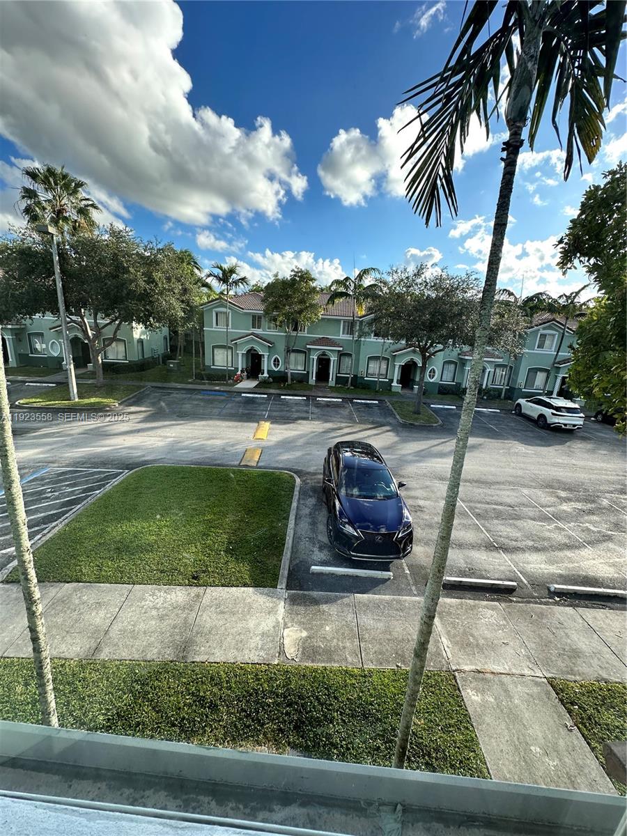 1529 Southeast 24th Court, Unit 233 Homestead, FL 33035 - Photo 2 of 35 a view of a backyard
