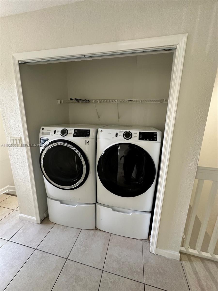 1529 Southeast 24th Court, Unit 233 Homestead, FL 33035 - Photo 27 of 35 a utility room with dryer and washer