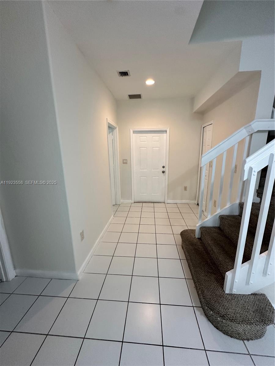1529 Southeast 24th Court, Unit 233 Homestead, FL 33035 - Photo 3 of 35 a view of an empty room and entryway