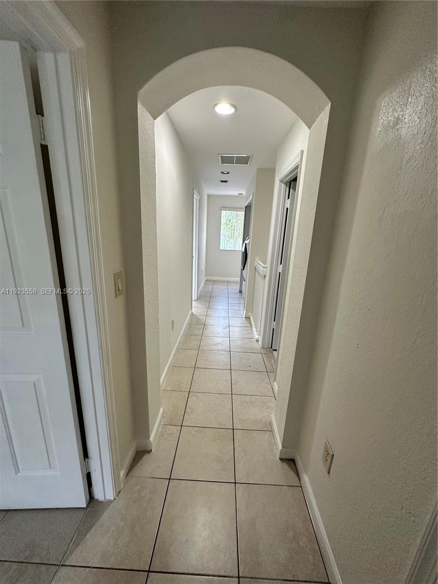 1529 Southeast 24th Court, Unit 233 Homestead, FL 33035 - Photo 9 of 35 a view of a hallway