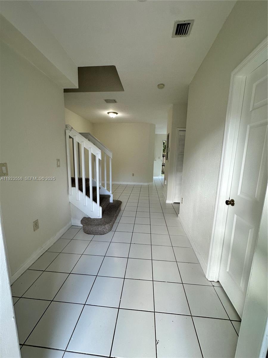 1529 Southeast 24th Court, Unit 233 Homestead, FL 33035 - Photo 10 of 35 a view of an entryway with a rug