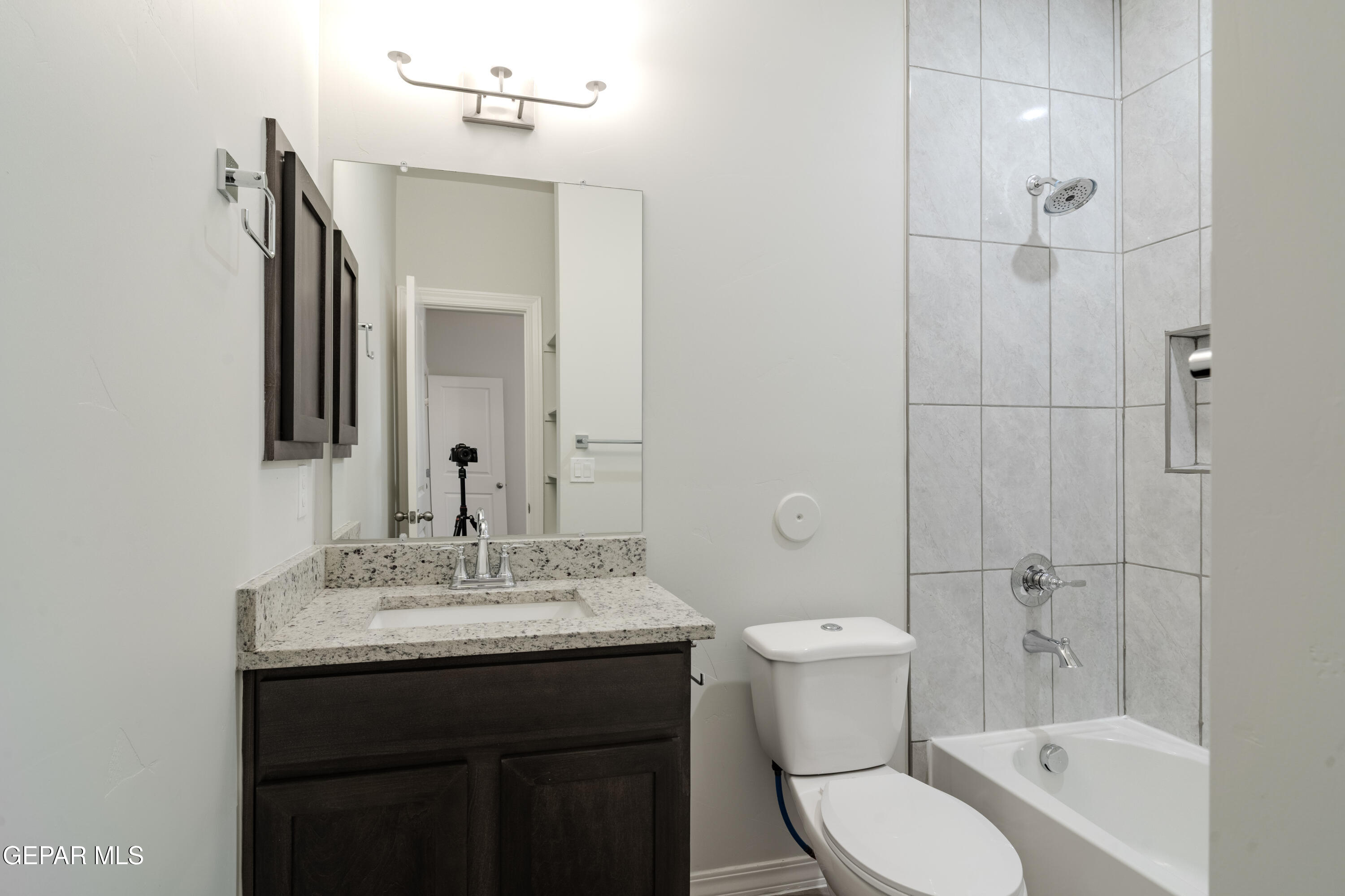 985 Barbara Avenue Socorro, TX 79927 - Photo 12 of 29 a bathroom with a sink toilet vanity and shower