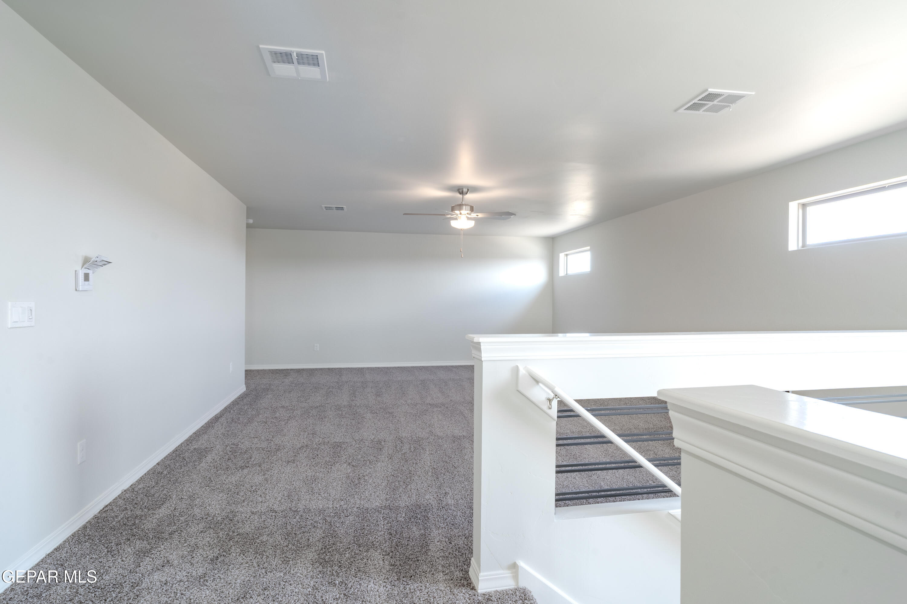 985 Barbara Avenue Socorro, TX 79927 - Photo 16 of 29 a view of a hallway with staircase