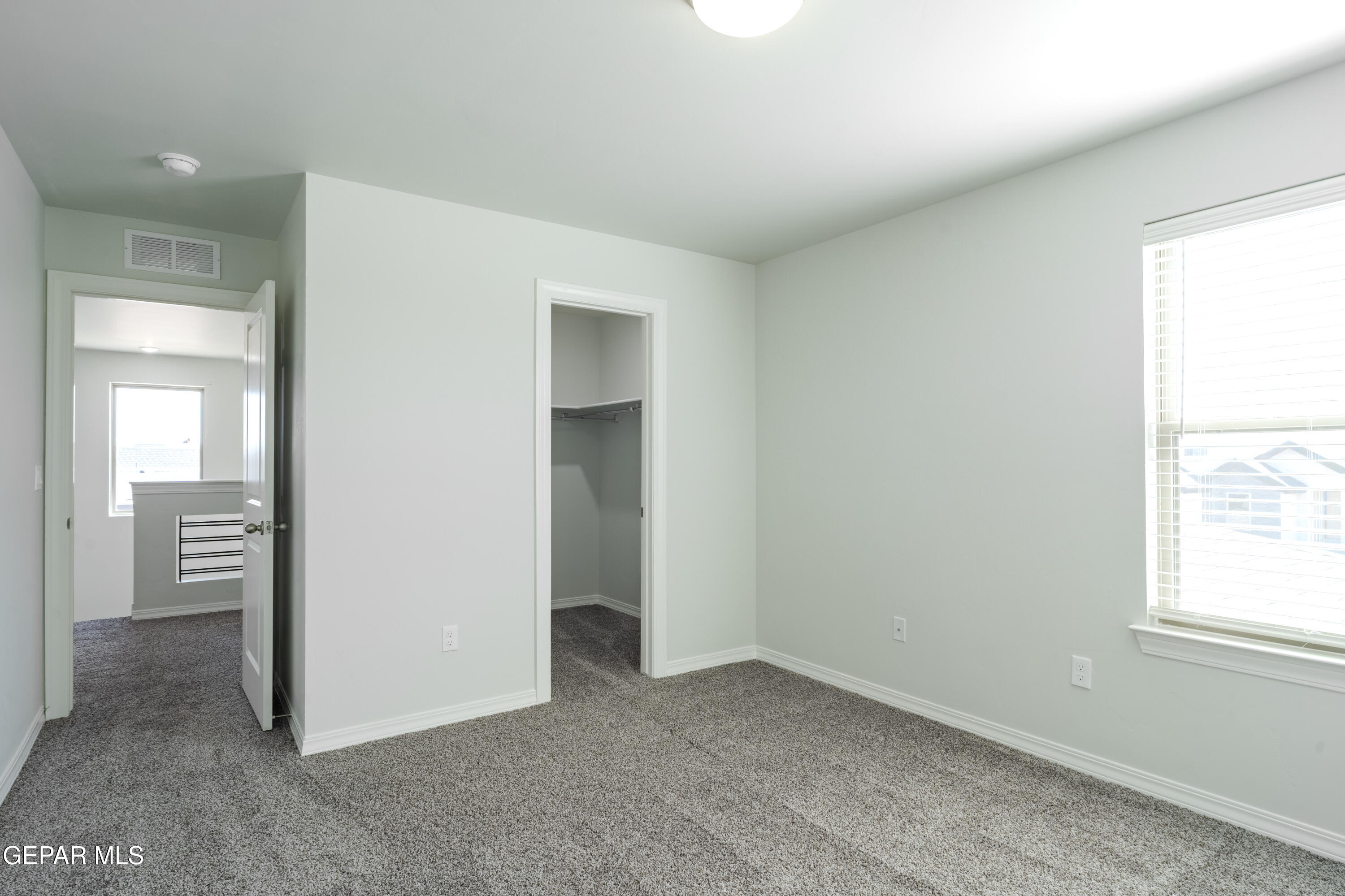 985 Barbara Avenue Socorro, TX 79927 - Photo 23 of 29 an empty room with windows and closet