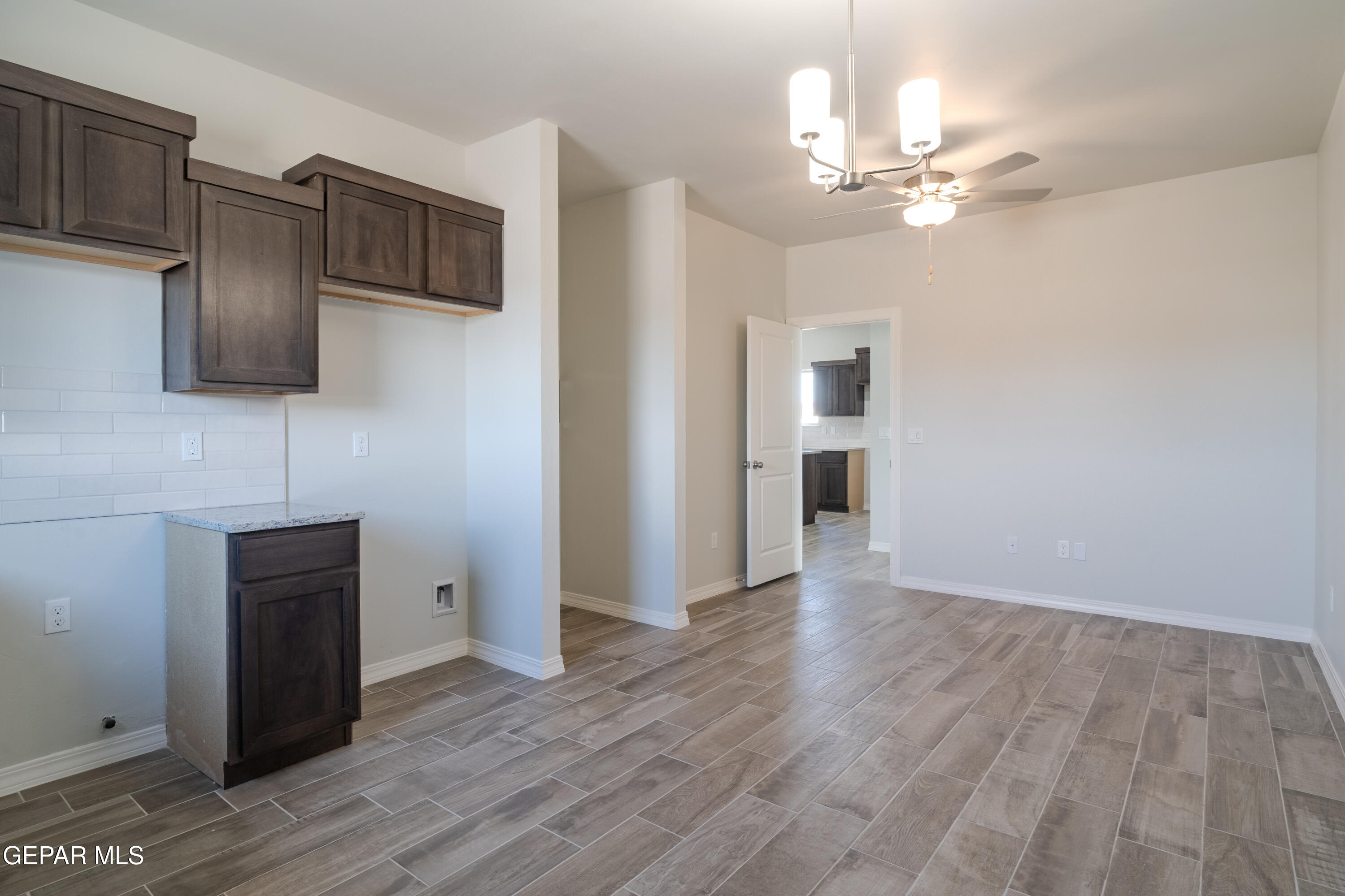 985 Barbara Avenue Socorro, TX 79927 - Photo 10 of 29 a view of a livingroom with an empty space and a window