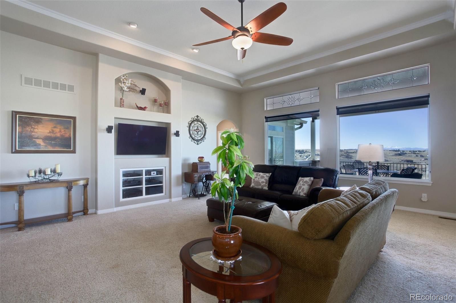 3441 Antelope Ridge Trail Parker, CO 80138 - Photo 13 of 50 a living room with furniture a chandelier and a window