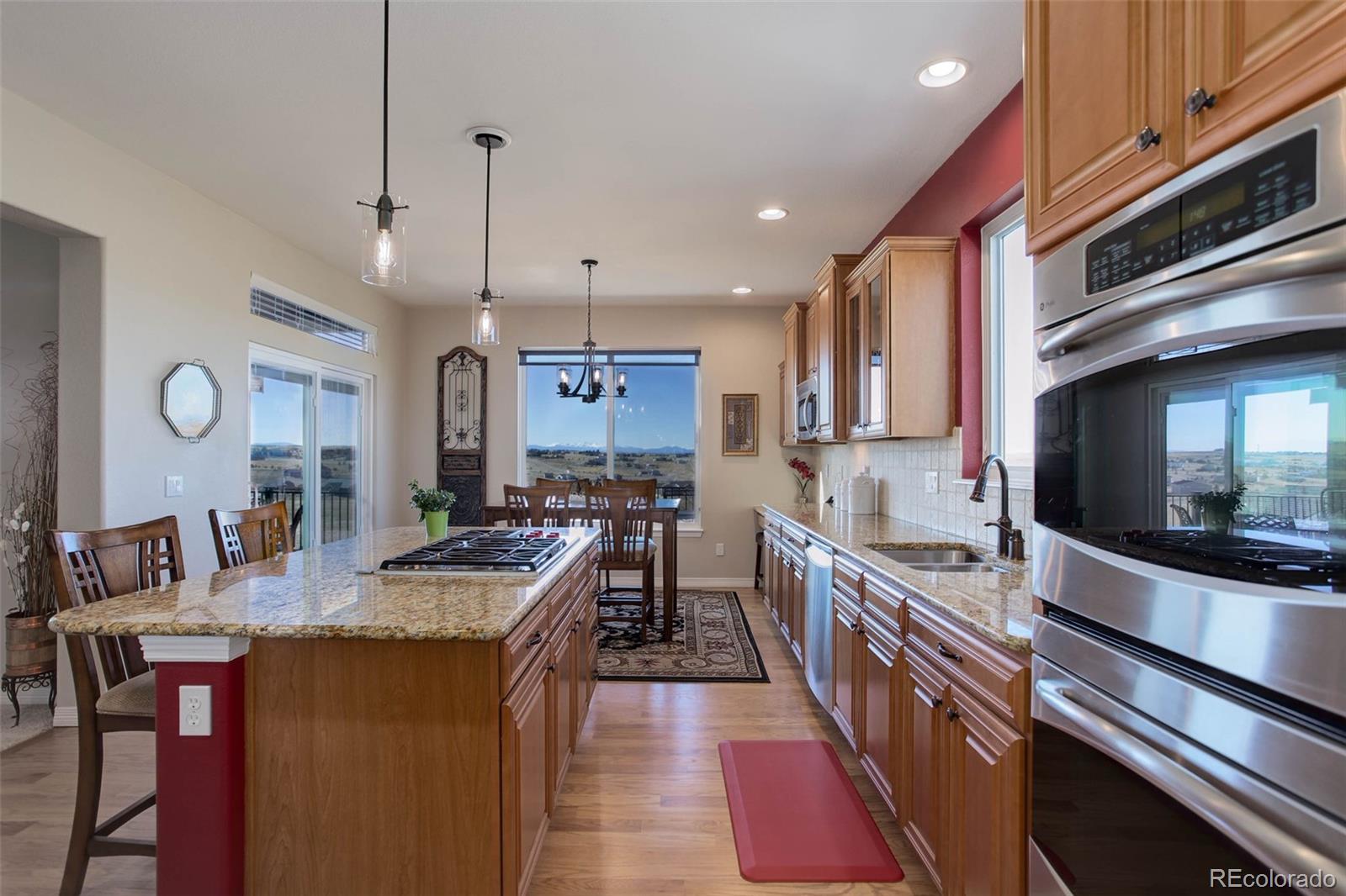 3441 Antelope Ridge Trail Parker, CO 80138 - Photo 17 of 50 a kitchen with granite countertop lots of counter top space