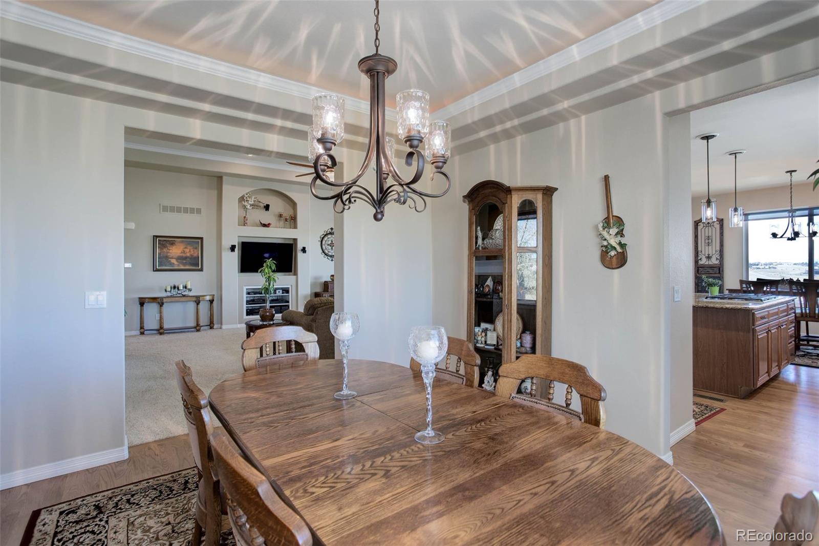 3441 Antelope Ridge Trail Parker, CO 80138 - Photo 20 of 50 a view of a dining room with furniture and a chandelier
