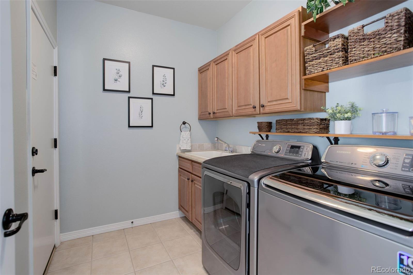 3441 Antelope Ridge Trail Parker, CO 80138 - Photo 22 of 50 a kitchen with a stove and cabinets