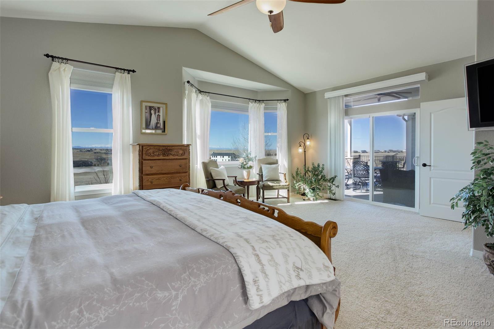3441 Antelope Ridge Trail Parker, CO 80138 - Photo 24 of 50 a spacious bedroom with a bed and a dresser