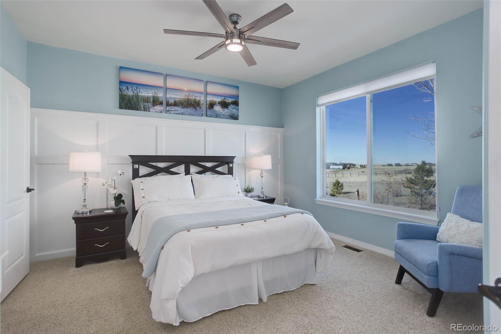 3441 Antelope Ridge Trail Parker, CO 80138 - Photo 29 of 50 a bedroom with a bed a couch and a window