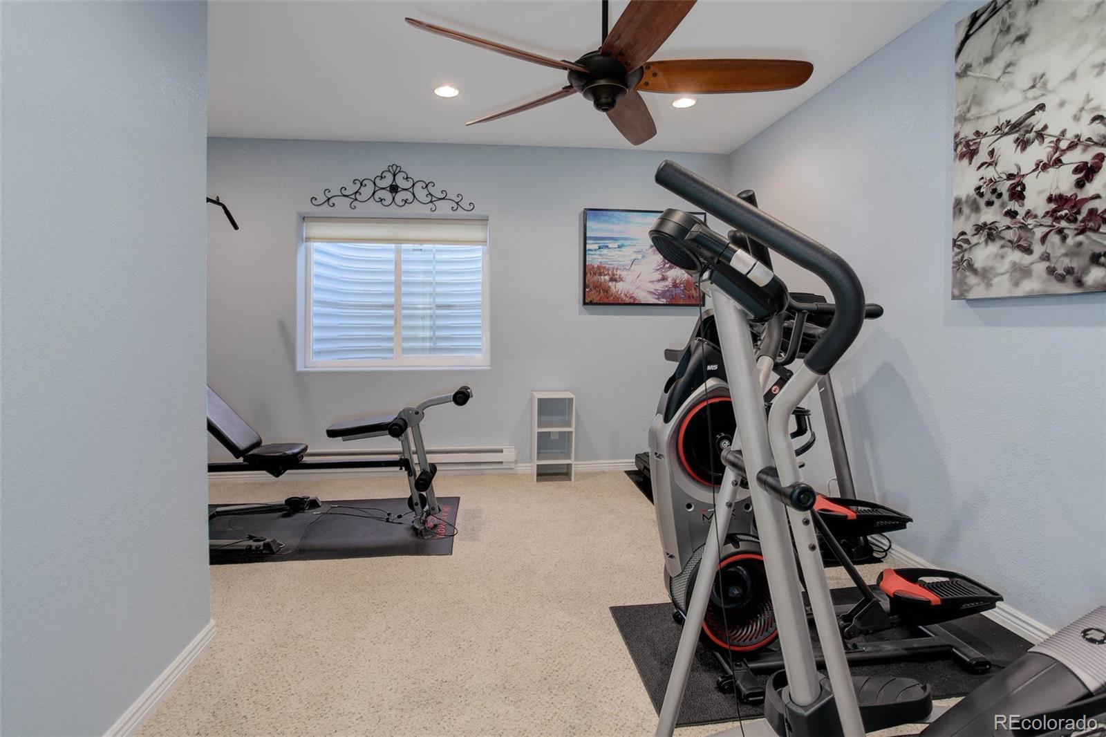 3441 Antelope Ridge Trail Parker, CO 80138 - Photo 32 of 50 a view of a room with gym equipment