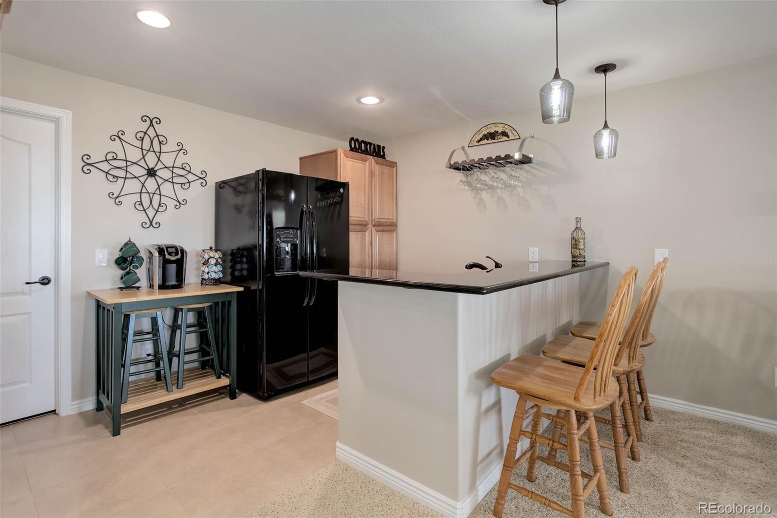 3441 Antelope Ridge Trail Parker, CO 80138 - Photo 36 of 50 a view of a workspace with furniture and wooden floor