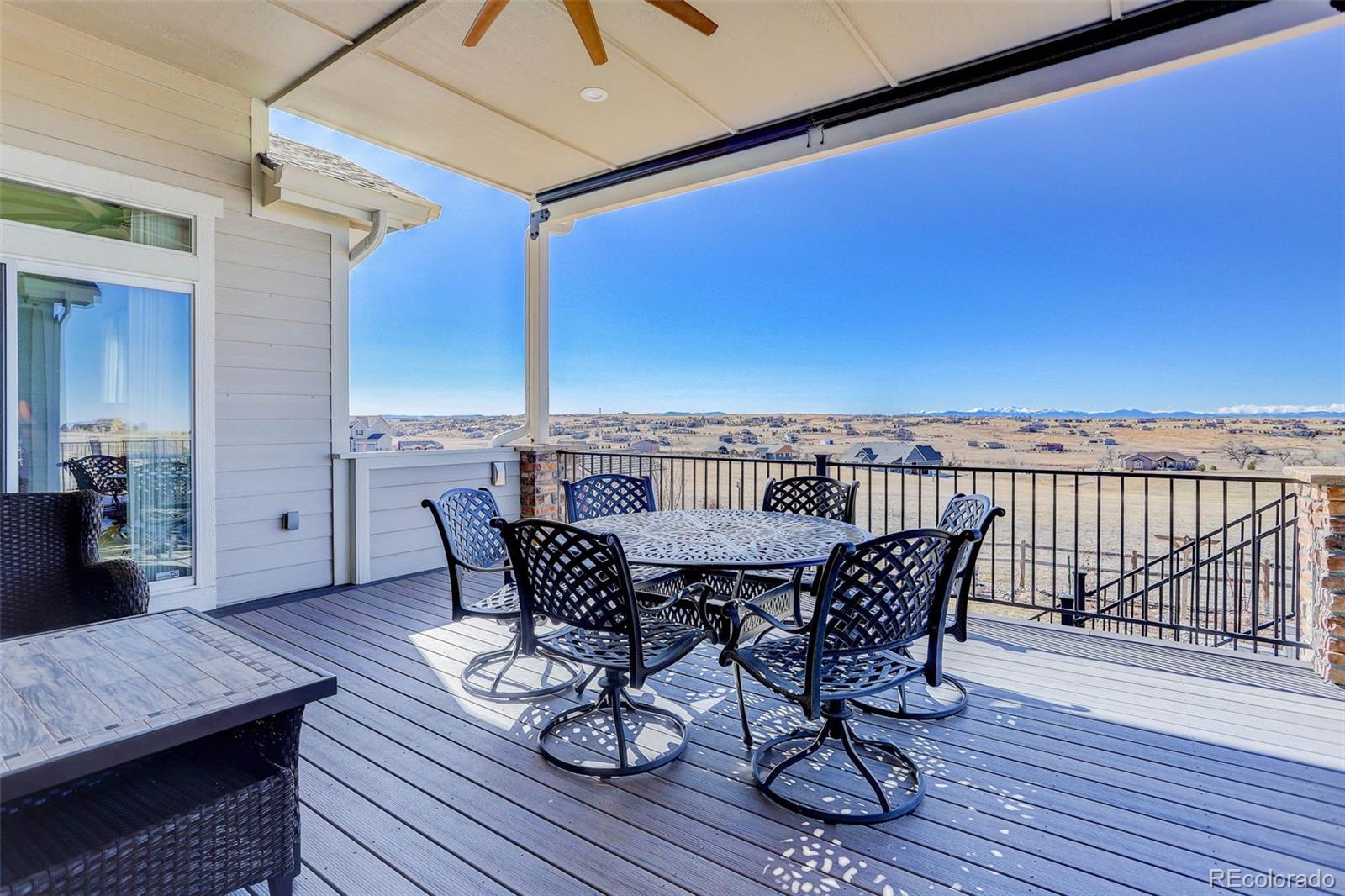 3441 Antelope Ridge Trail Parker, CO 80138 - Photo 39 of 50 a view of a roof deck with table and chairs