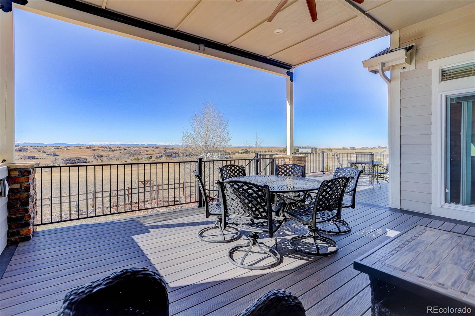 3441 Antelope Ridge Trail Parker, CO 80138 - Photo 40 of 50 a view of a roof deck with table and chairs