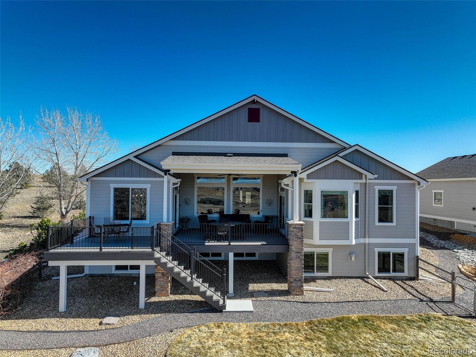 3441 Antelope Ridge Trail Parker, CO 80138 - Photo 45 of 50 a front view of a house with garden