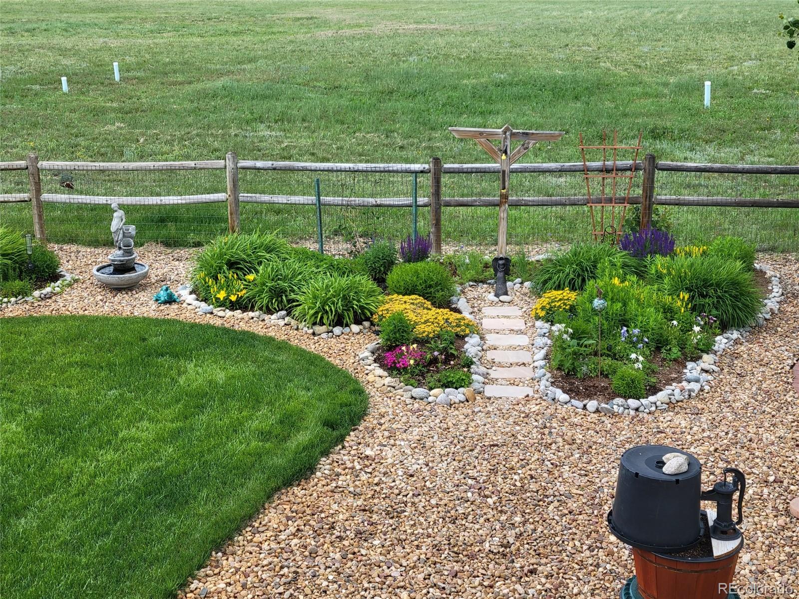 3441 Antelope Ridge Trail Parker, CO 80138 - Photo 46 of 50 a view of a garden with plants and large trees