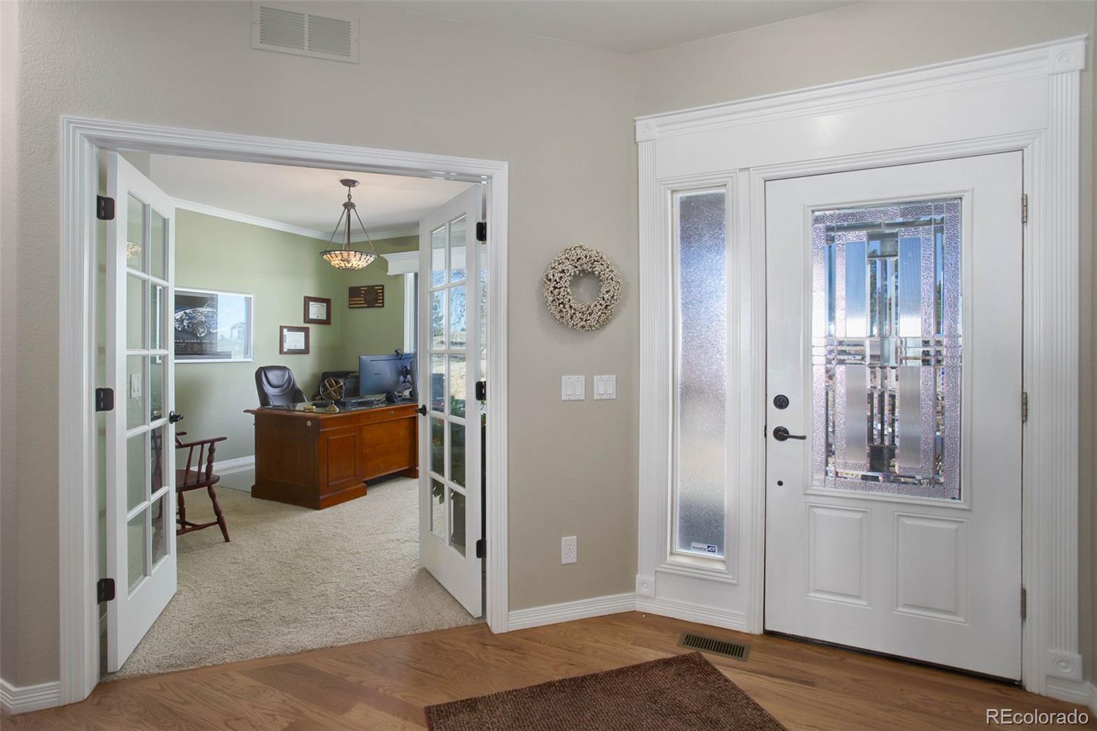 3441 Antelope Ridge Trail Parker, CO 80138 - Photo 7 of 50 a living room with furniture and a window