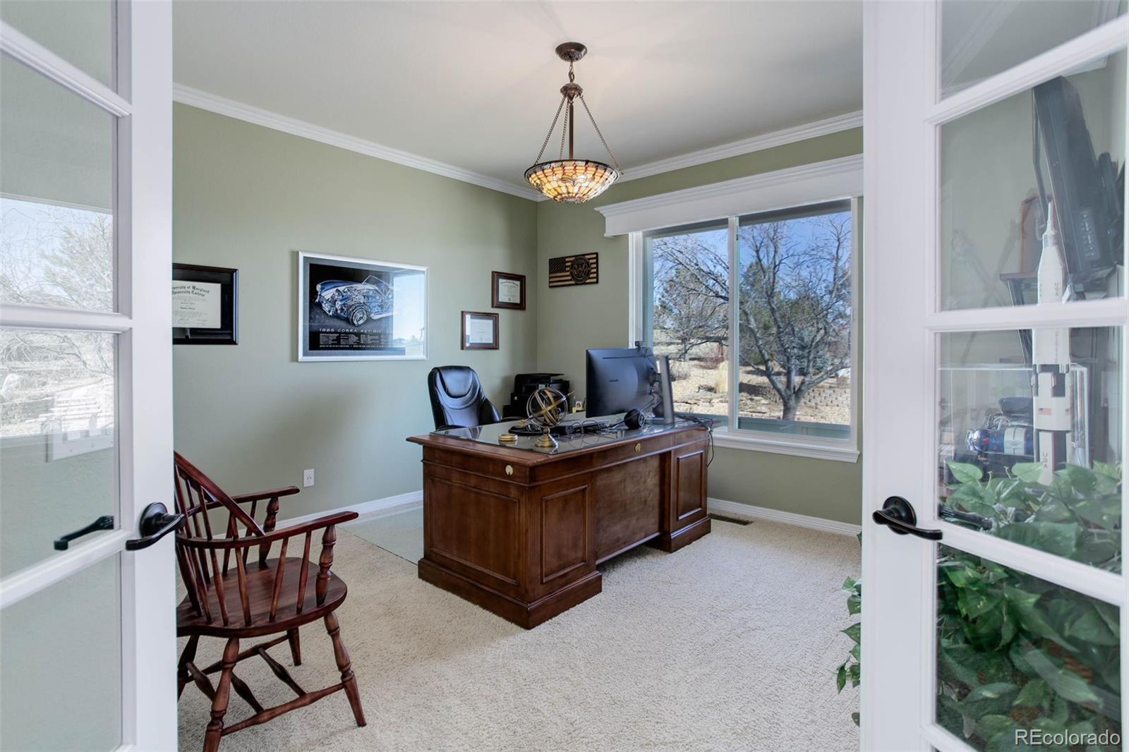 3441 Antelope Ridge Trail Parker, CO 80138 - Photo 8 of 50 a living room with furniture and a large window