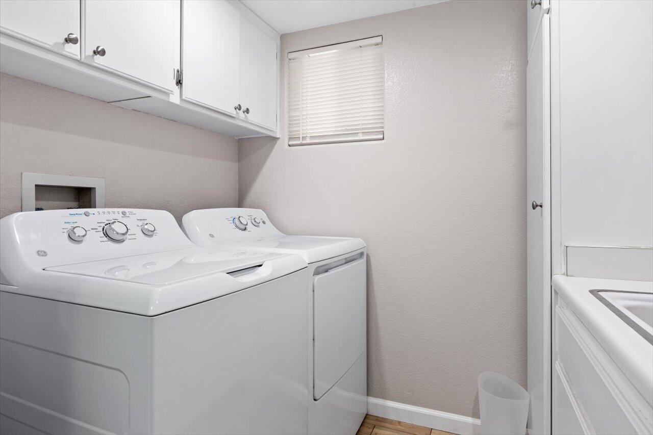 911 Rivertree Drive Oceanside, CA 92058 - Photo 15 of 43 a utility room with dryer and washer