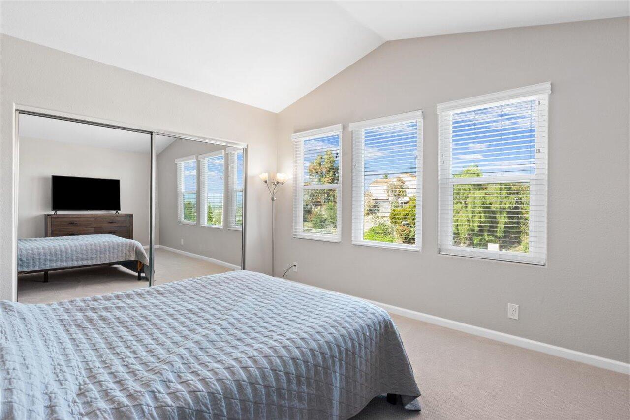 911 Rivertree Drive Oceanside, CA 92058 - Photo 16 of 43 a bedroom with a bed and a couch