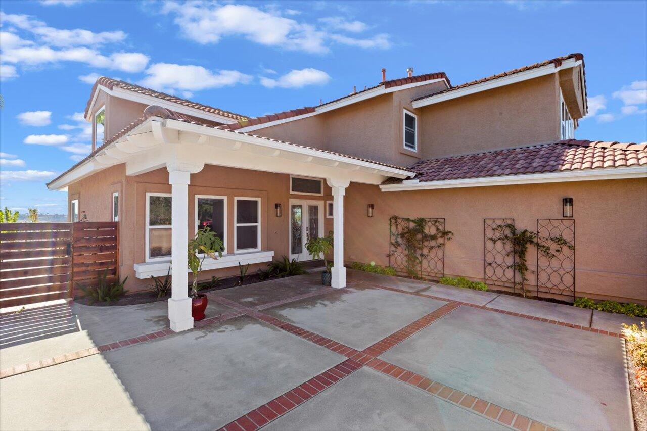 911 Rivertree Drive Oceanside, CA 92058 - Photo 3 of 43 a front view of a house with a garage