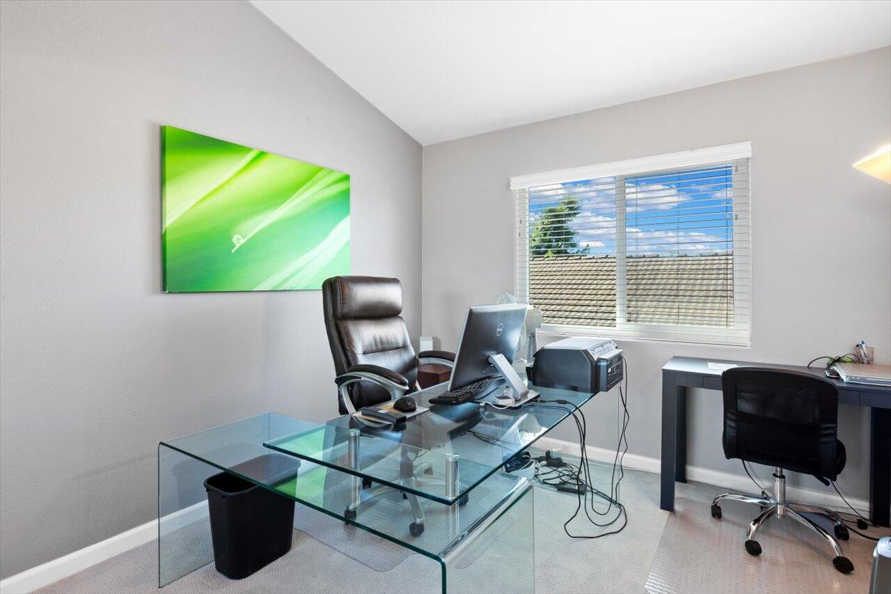 911 Rivertree Drive Oceanside, CA 92058 - Photo 26 of 43 a view of a workspace with furniture and a window