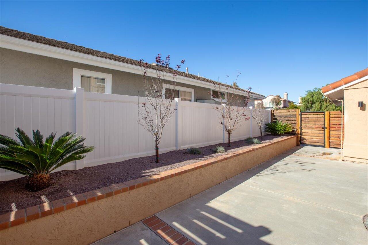 911 Rivertree Drive Oceanside, CA 92058 - Photo 35 of 43 a front view of a house with a yard