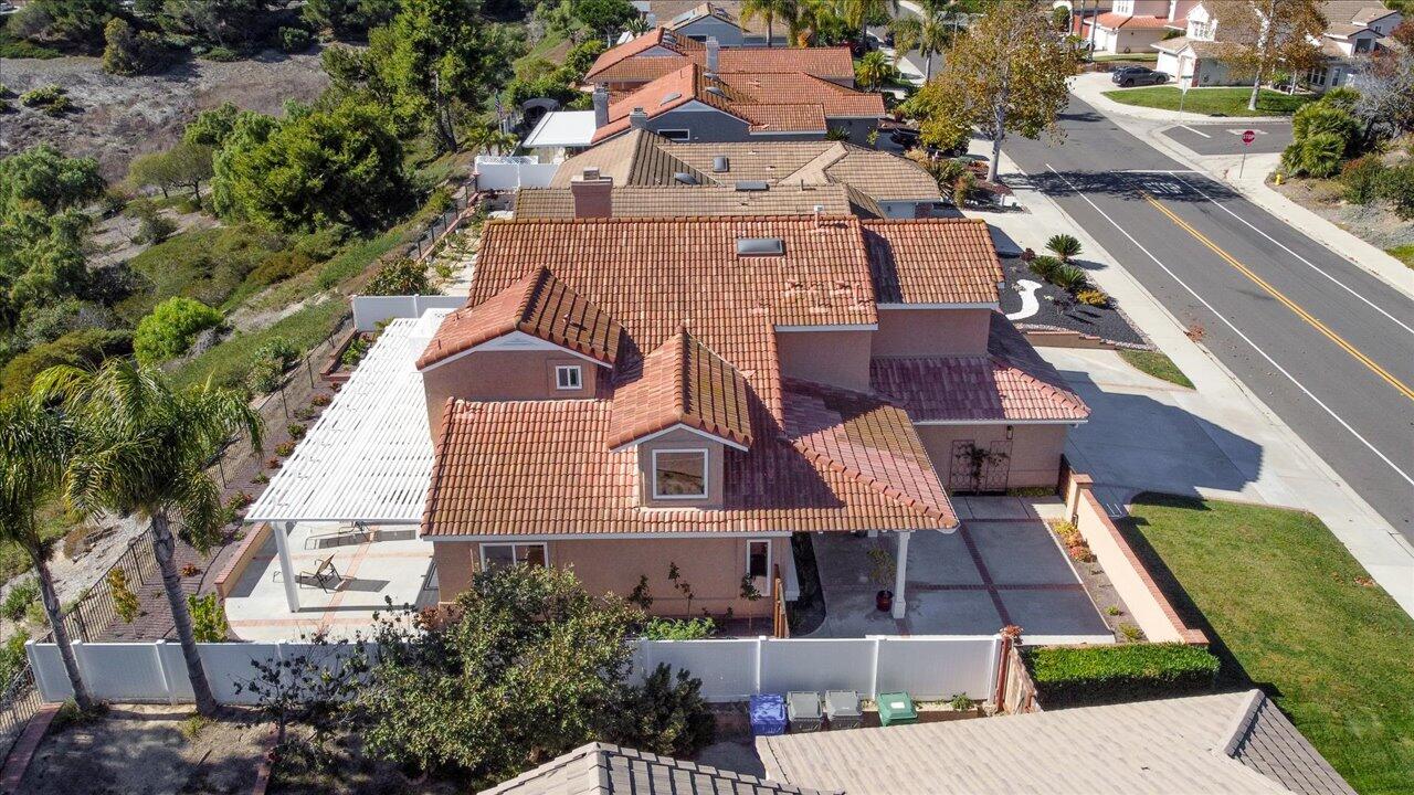 911 Rivertree Drive Oceanside, CA 92058 - Photo 36 of 43 an aerial view of multiple houses with a yard