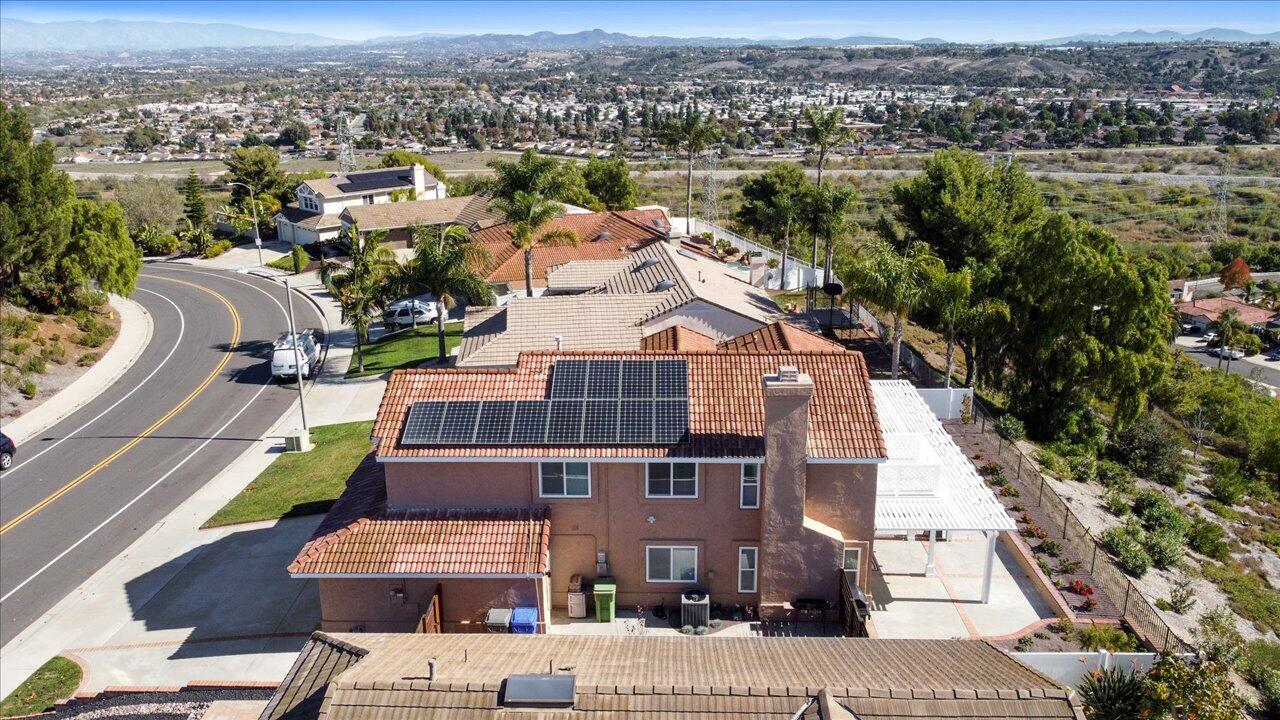 911 Rivertree Drive Oceanside, CA 92058 - Photo 38 of 43 an aerial view of multiple houses with a yard