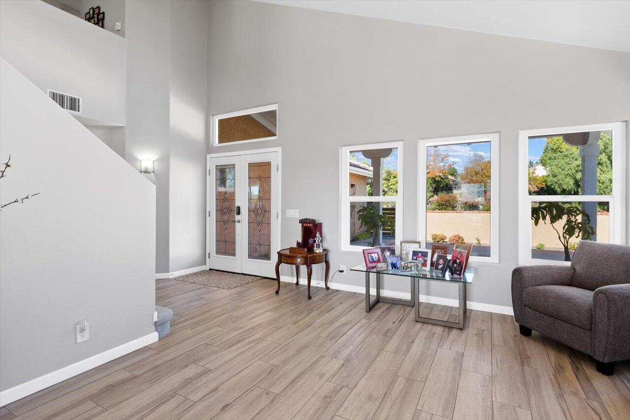 911 Rivertree Drive Oceanside, CA 92058 - Photo 5 of 43 a living room with furniture and a wooden floor