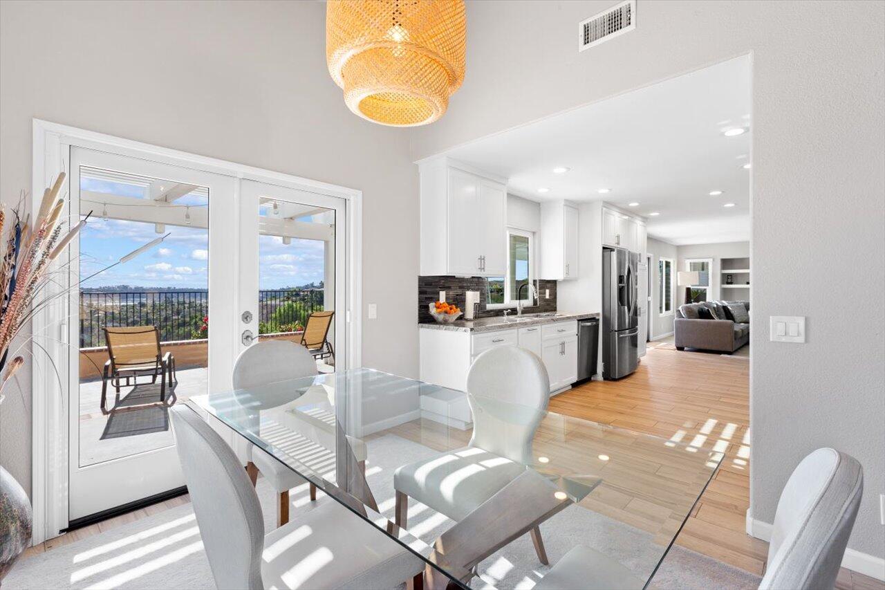 911 Rivertree Drive Oceanside, CA 92058 - Photo 7 of 43 a living room with kitchen island furniture and a view of kitchen