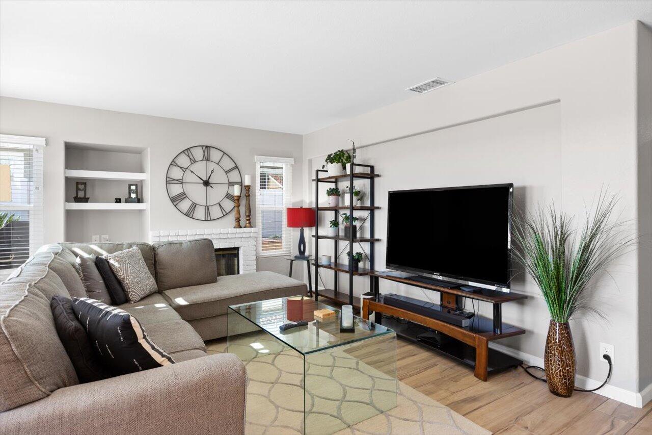 911 Rivertree Drive Oceanside, CA 92058 - Photo 10 of 43 a living room with furniture and a flat screen tv