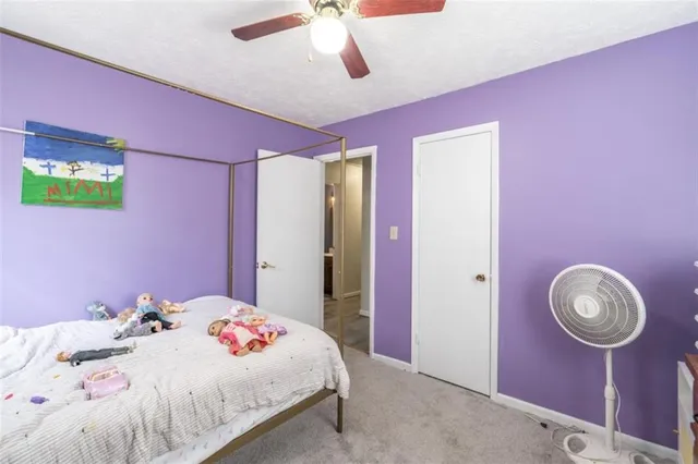 a bathroom with a sink a toilet and shower curtain