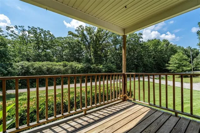a balcony with wooden floor in outdoor space