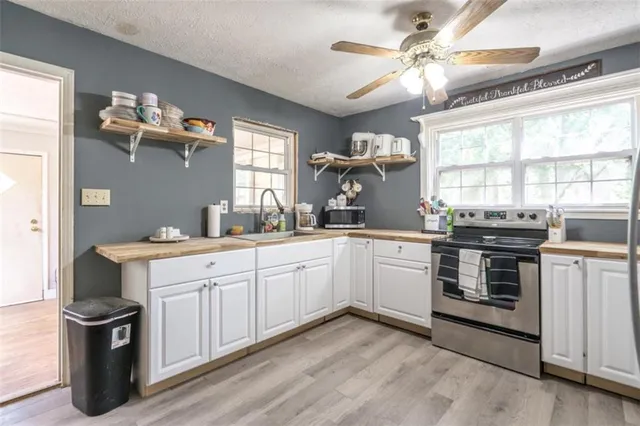 a kitchen with a stove oven and sink