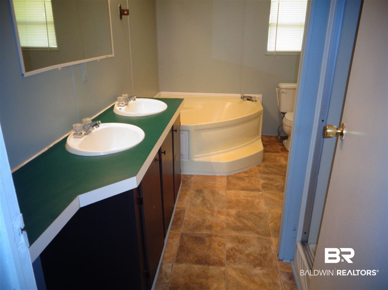 21535 A Glass And Spivey Road Robertsdale, AL 36567 - Photo 21 of 32 13x7. Double vanity. Exhaust fan.