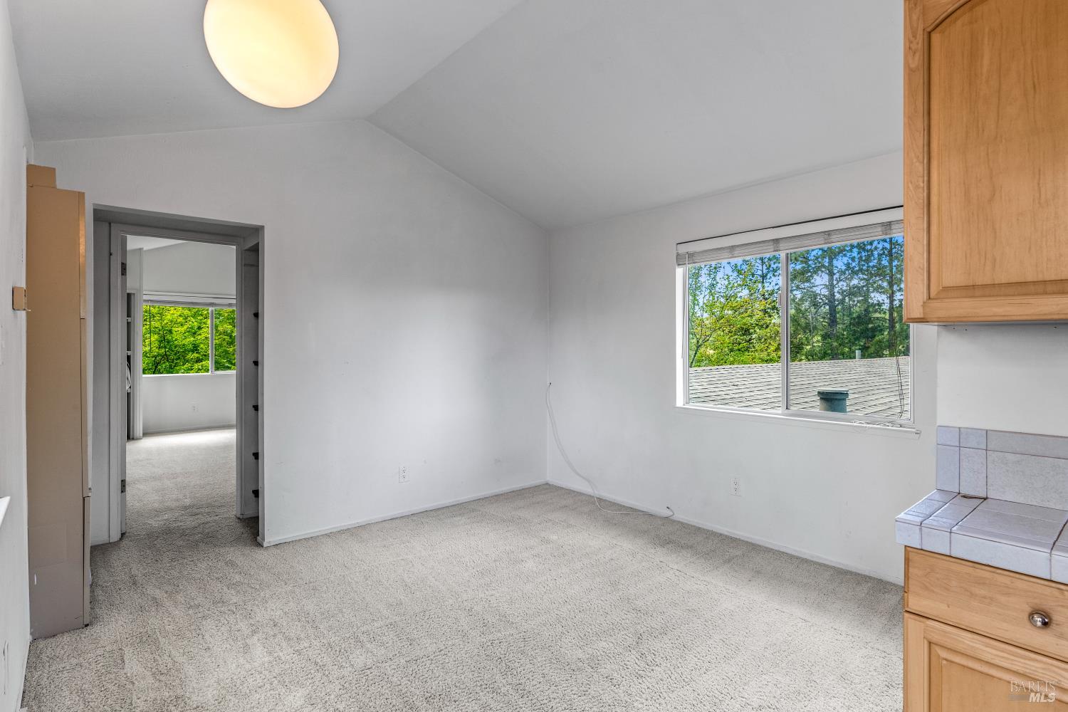 625-629 Hill Road Angwin, CA 94508 - Photo 54 of 64 an empty room with a window and mirror