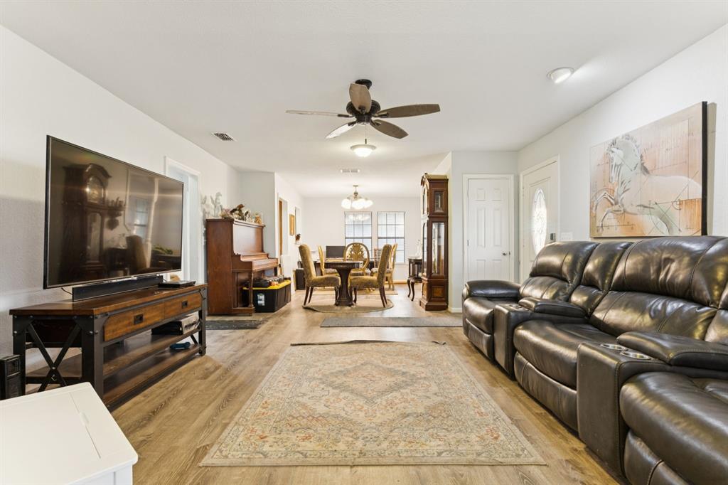 202 Blue Mound Road East Haslet, TX 76052 - Photo 11 of 31 a living room with furniture and a flat screen tv
