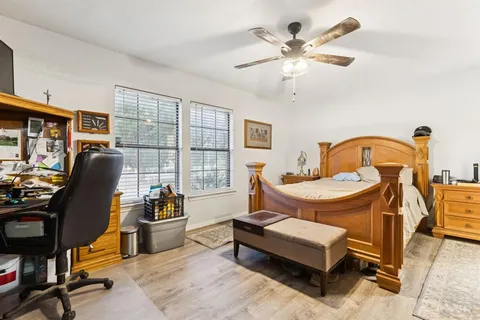 a living room with a table chairs and a window