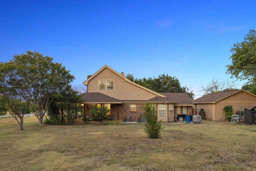 202 Blue Mound Road East Haslet, TX 76052 - Photo 8 of 31 a front view of a house with a yard