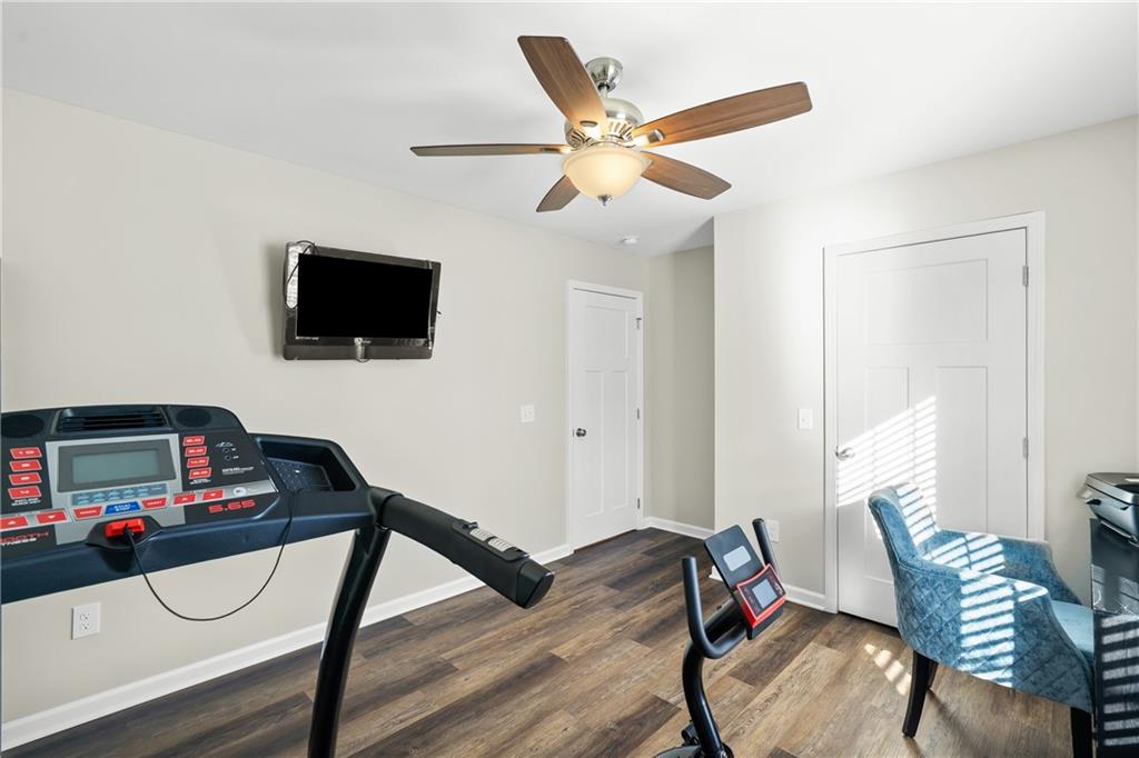 2708 Quarles Road Rocky Face, GA 30740 - Photo 25 of 40 a living room with furniture and a flat screen tv