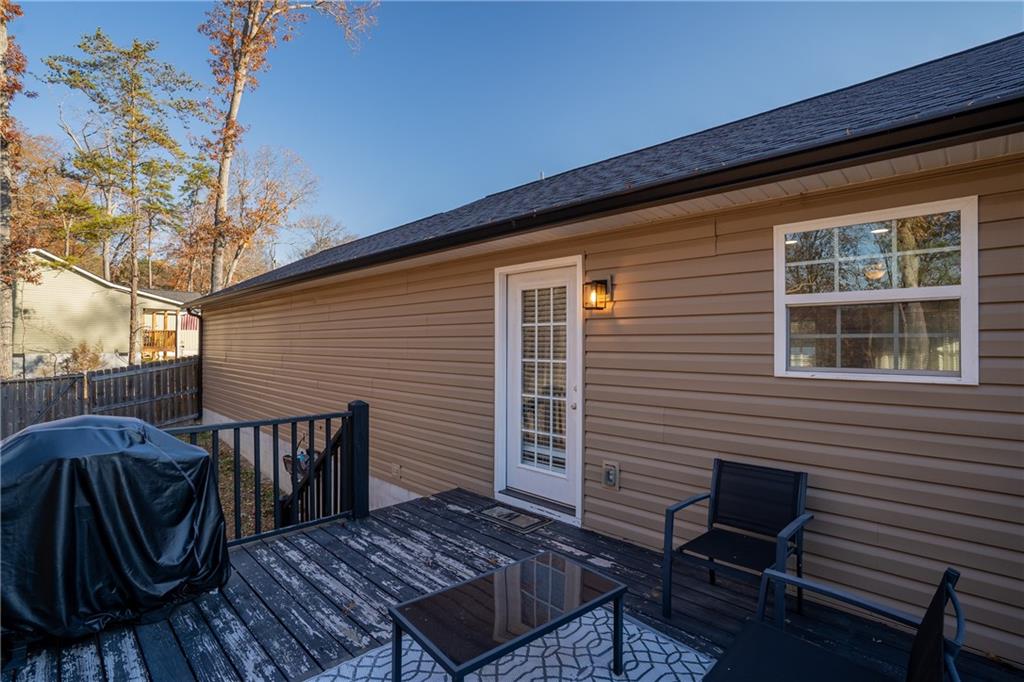 2708 Quarles Road Rocky Face, GA 30740 - Photo 29 of 40 a view of a chairs and table on the deck