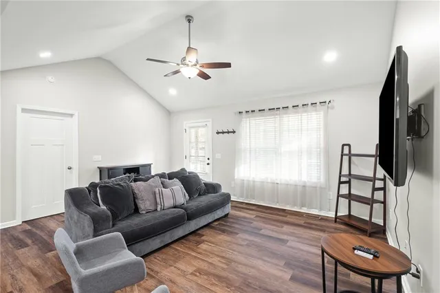 a kitchen with stainless steel appliances granite countertop a sink a microwave and cabinets
